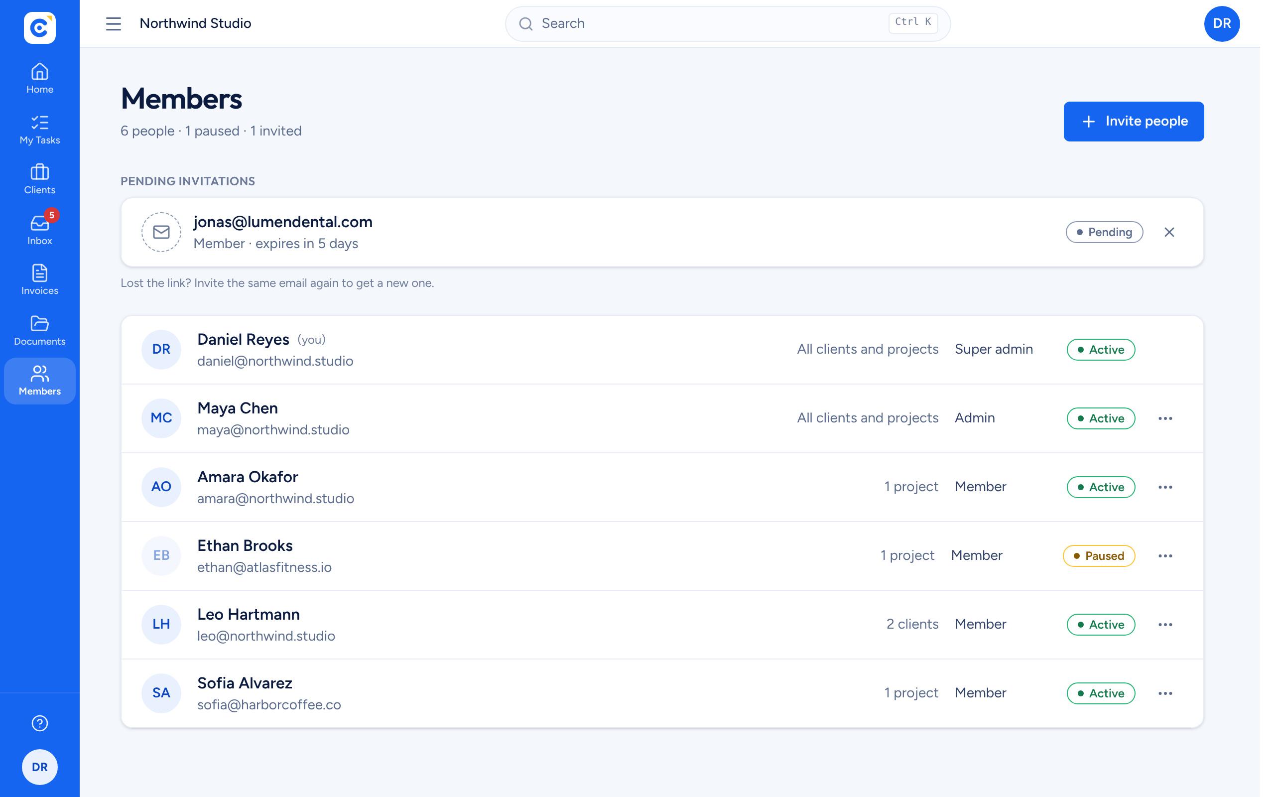 The Clientfolk members list with roles, client and project access, and status